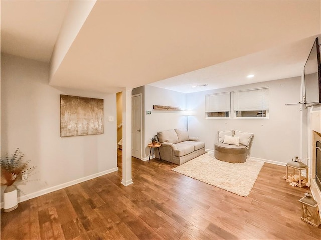 living room with recessed lighting, wood finished floors, and baseboards