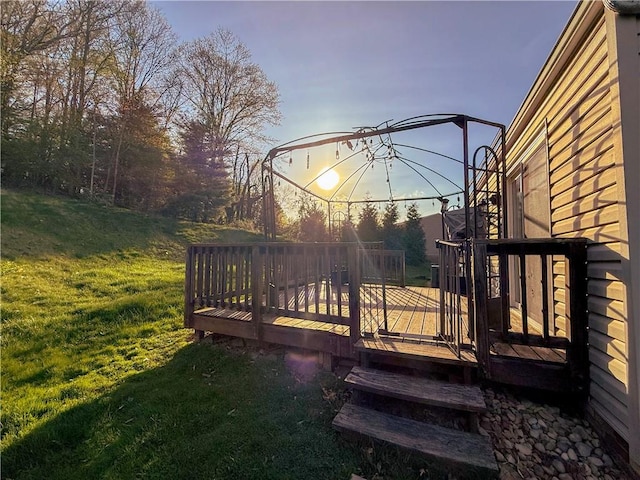 wooden deck featuring a yard