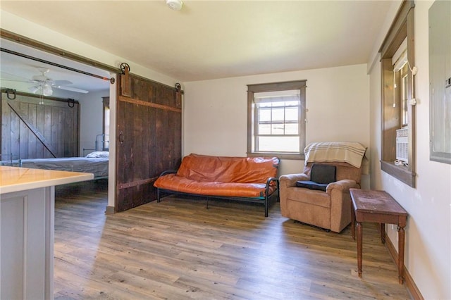 2939 Perry Hwy, Perry Twp Mer, PA 16130 - sitting room with baseboards, a barn door, and wood finished floors