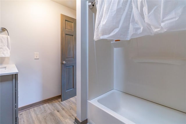 2939 Perry Hwy, Perry Twp Mer, PA 16130 - bathroom with baseboards, wood finished floors, shower / bath combination, and vanity