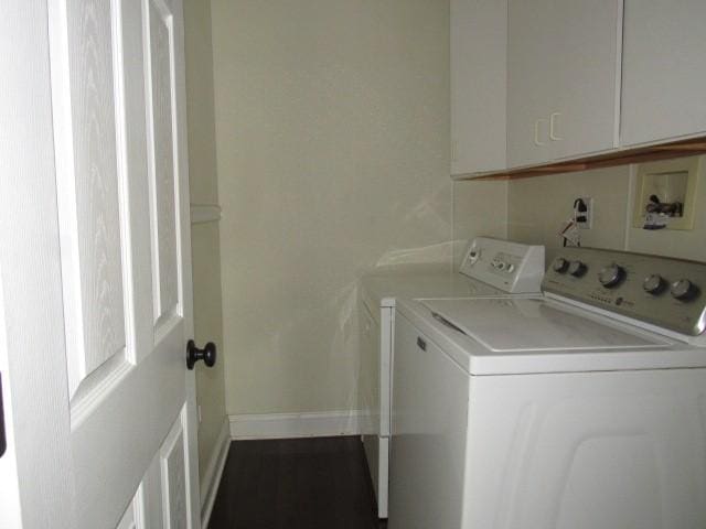 laundry room featuring independent washer and dryer, cabinet space, and baseboards
