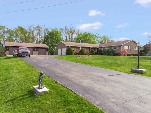 254 Walnut St, Chartiers, PA 15342 - ranch-style house featuring a detached garage, a front yard, and brick siding