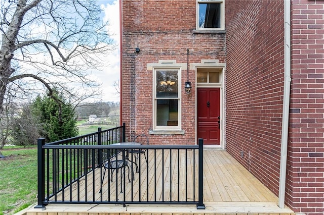 property entrance with brick siding