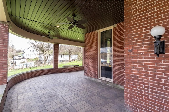 view of patio featuring ceiling fan