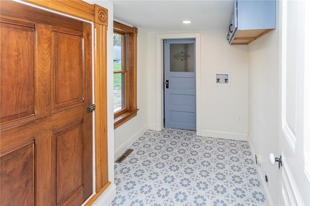 laundry area featuring recessed lighting, cabinet space, washer hookup, visible vents, and baseboards