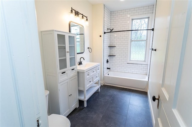 bathroom featuring toilet, a wealth of natural light, vanity, and shower / bathing tub combination