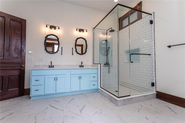 bathroom featuring baseboards, a shower stall, and marble finish floor