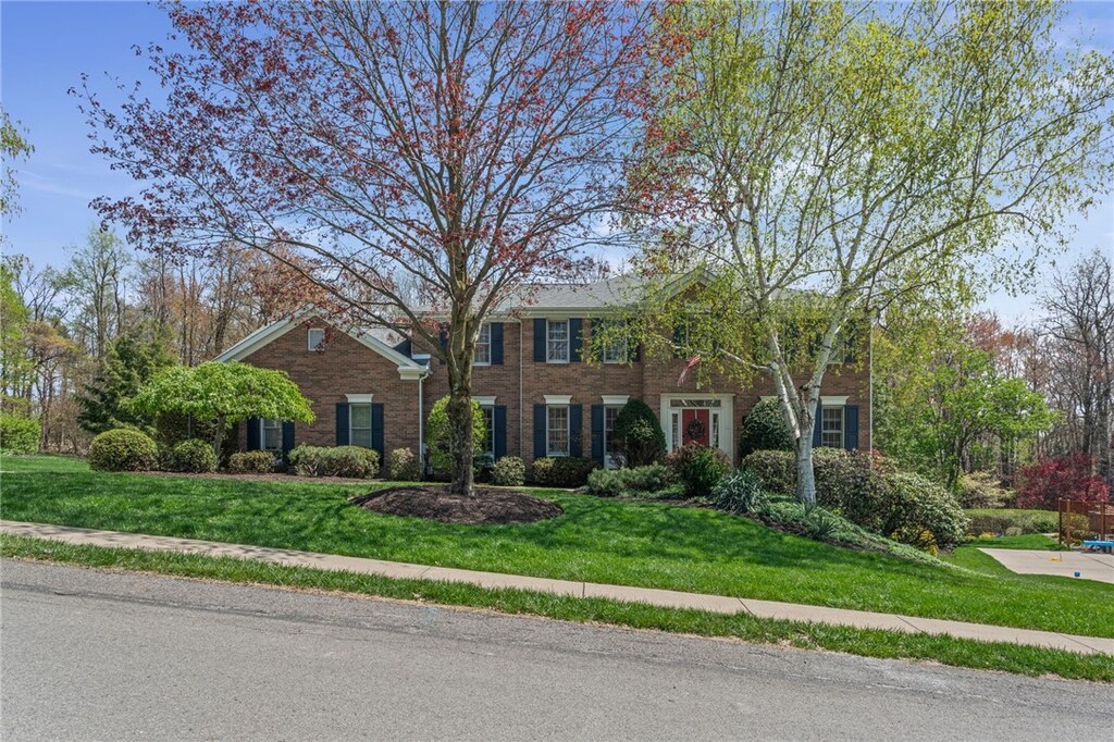 217 Ash Ct, Marshall, PA 15090 - view of front of house with brick siding and a front yard