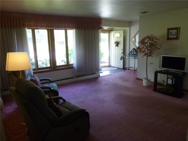 living area with baseboard heating, carpet flooring, and a baseboard heating unit