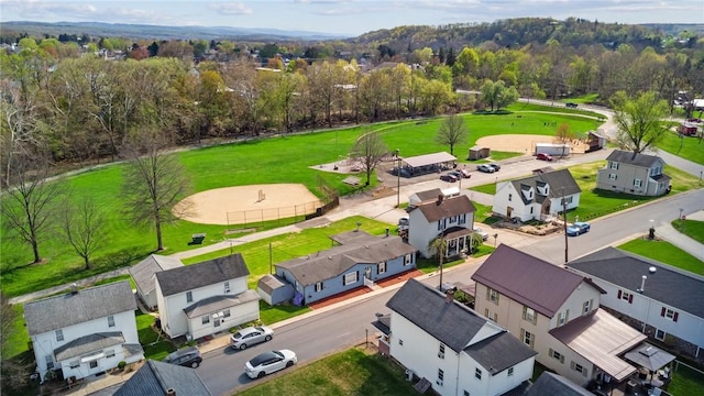 aerial view featuring a residential view and a forest view