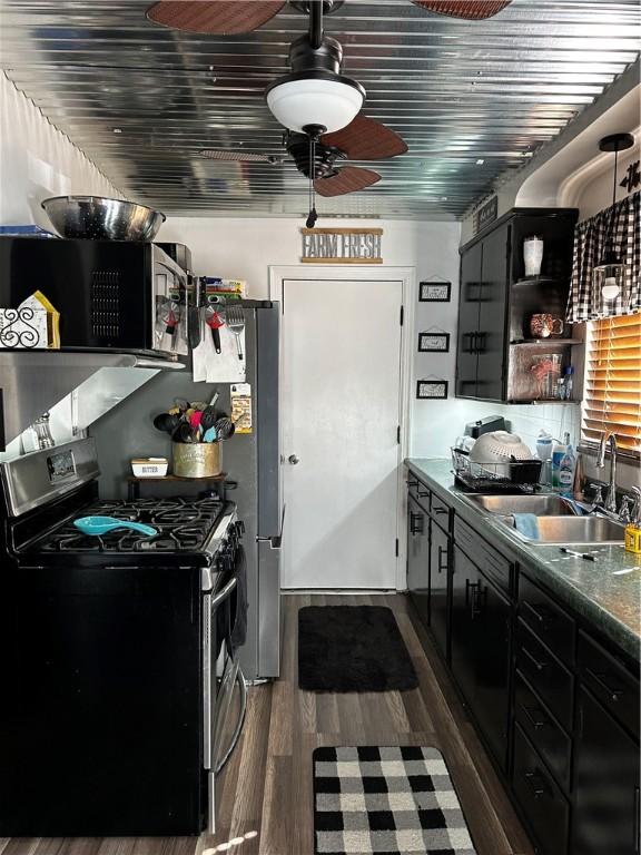 408 Craigdell Rd, New Kensington, PA 15068 - kitchen with a sink, stainless steel appliances, open shelves, dark wood-type flooring, and dark countertops