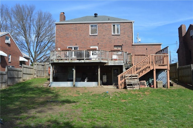 408 Craigdell Rd, New Kensington, PA 15068 - back of house featuring a deck, a chimney, a fenced backyard, a yard, and brick siding