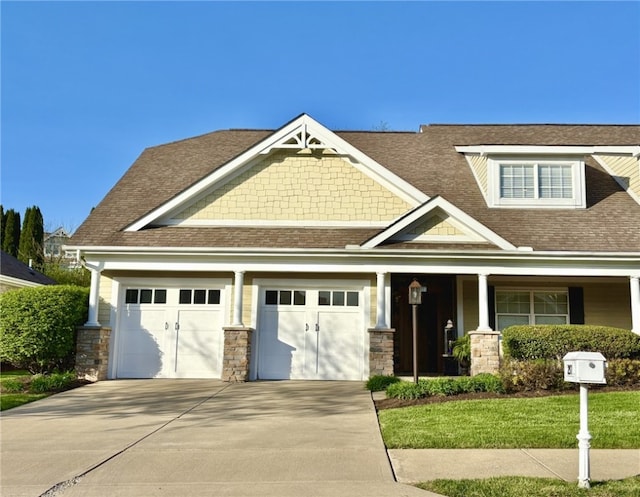 231 Berkeley Way, Monroeville, PA 15146 - craftsman inspired home featuring driveway, stone siding, a shingled roof, an attached garage, and a porch