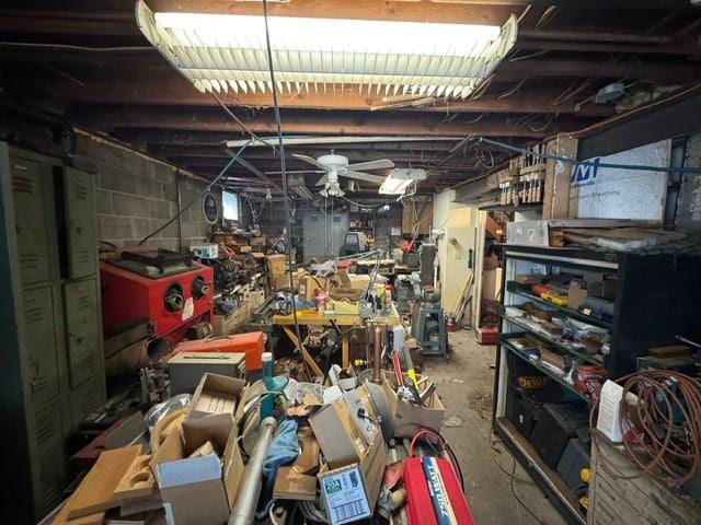 unfinished basement featuring a workshop area