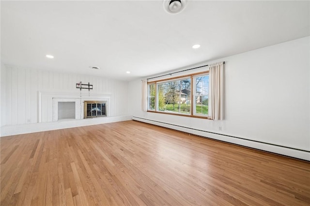 3352 Evergreen Dr, Murrysville, PA 15668 - unfurnished living room with recessed lighting, light wood-style flooring, and baseboard heating