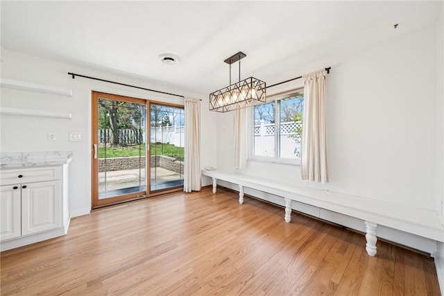 3352 Evergreen Dr, Murrysville, PA 15668 - unfurnished dining area with baseboards and light wood-style flooring