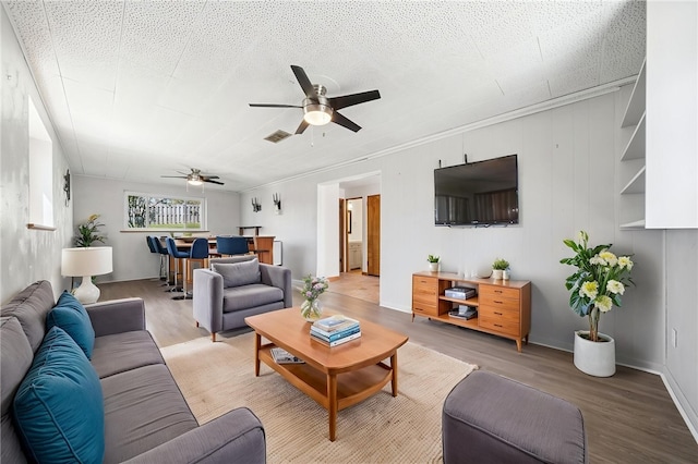 3352 Evergreen Dr, Murrysville, PA 15668 - living room with visible vents, light wood-type flooring, and a ceiling fan
