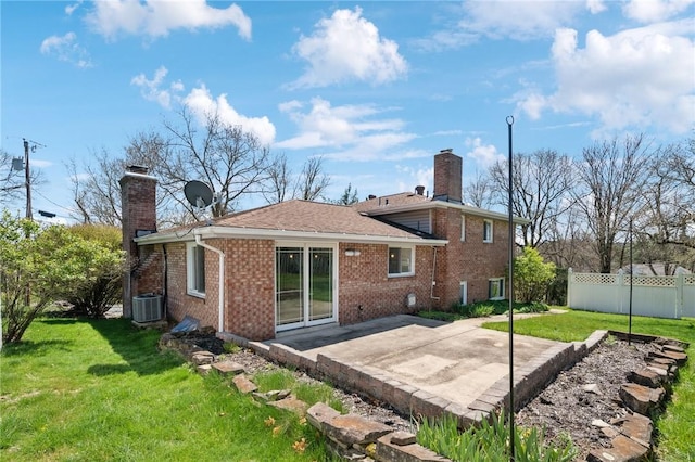 3352 Evergreen Dr, Murrysville, PA 15668 - back of house featuring a chimney, a patio area, and brick siding