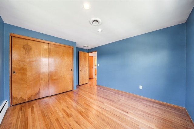 3352 Evergreen Dr, Murrysville, PA 15668 - unfurnished bedroom featuring a baseboard radiator, light wood-style floors, visible vents, a closet, and recessed lighting