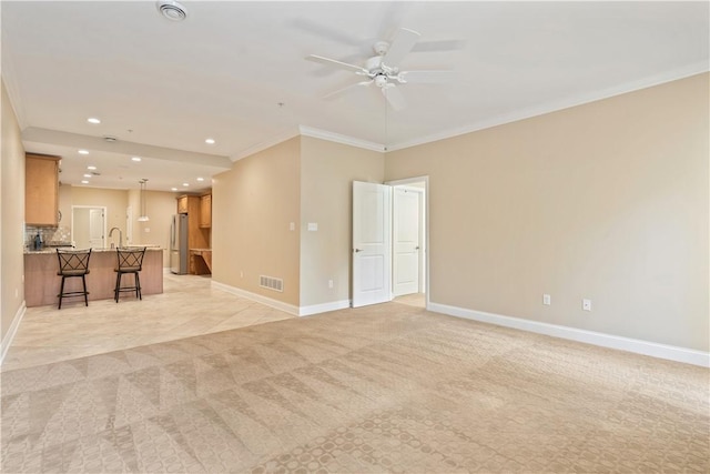 unfurnished living room featuring visible vents, recessed lighting, ornamental molding, and baseboards