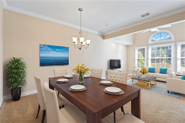 dining space featuring crown molding, light colored carpet, visible vents, baseboards, and an inviting chandelier