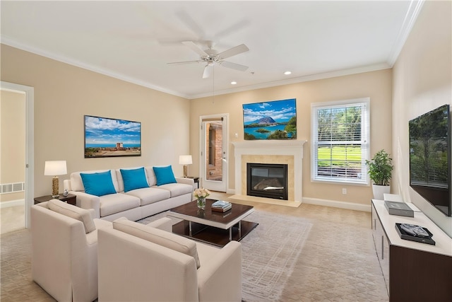 living room with light colored carpet, visible vents, a glass covered fireplace, recessed lighting, and a ceiling fan
