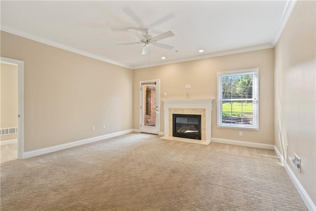 unfurnished living room featuring visible vents, ceiling fan, ornamental molding, and carpet floors