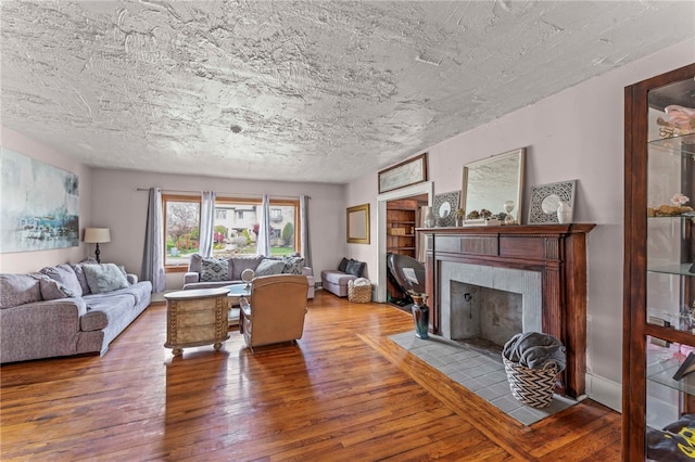 408 N Wade Ave E, Washington Boro, PA 15301 - living room featuring a fireplace, a textured ceiling, and wood finished floors