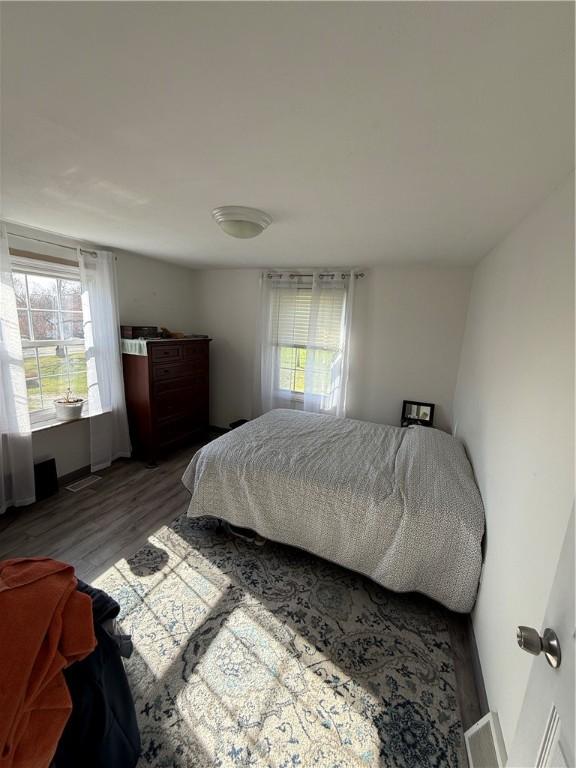 1611 Oneida Valley Rd, Concord Twp, PA 16025 - bedroom with wood finished floors and multiple windows