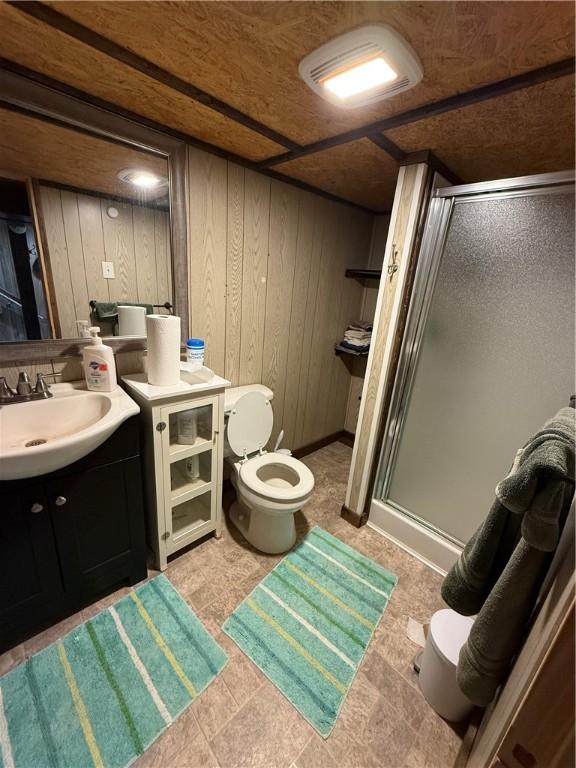 1611 Oneida Valley Rd, Concord Twp, PA 16025 - full bathroom with wood walls, a stall shower, toilet, and vanity