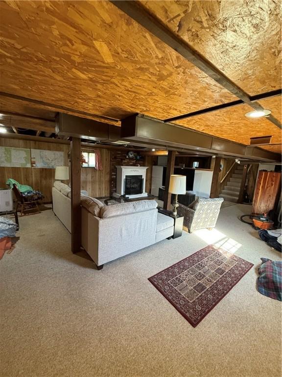1611 Oneida Valley Rd, Concord Twp, PA 16025 - living room with wood walls, carpet flooring, and stairs