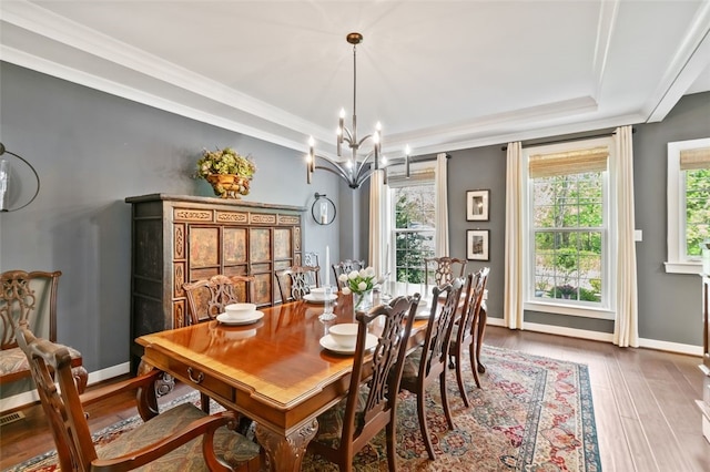 331 Boundary St, Sewickley, PA 15143 - dining space featuring wood finished floors, a chandelier, baseboards, crown molding, and a tray ceiling