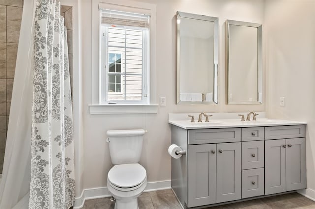 331 Boundary St, Sewickley, PA 15143 - full bathroom featuring baseboards, toilet, double vanity, and a sink