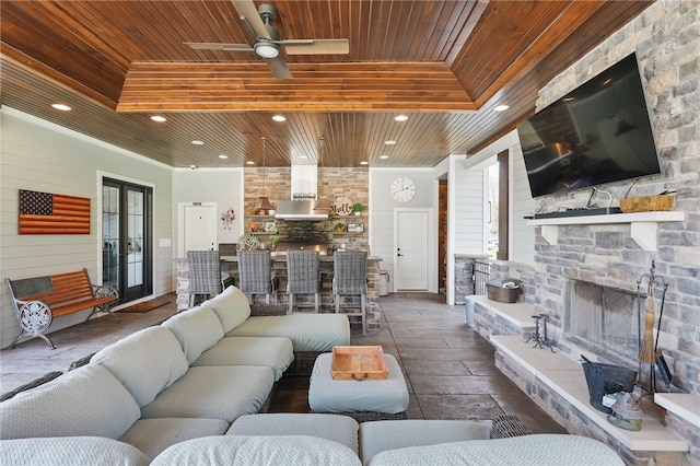 133 Morningside Dr, Cranberry Twp, PA 16066 - living area with wood ceiling, an outdoor stone fireplace, recessed lighting, and ceiling fan