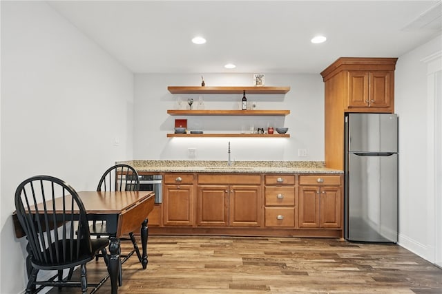 133 Morningside Dr, Cranberry Twp, PA 16066 - kitchen with stainless steel appliances, a sink, brown cabinetry, open shelves, and light wood-type flooring