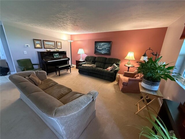 living area featuring carpet and a textured ceiling