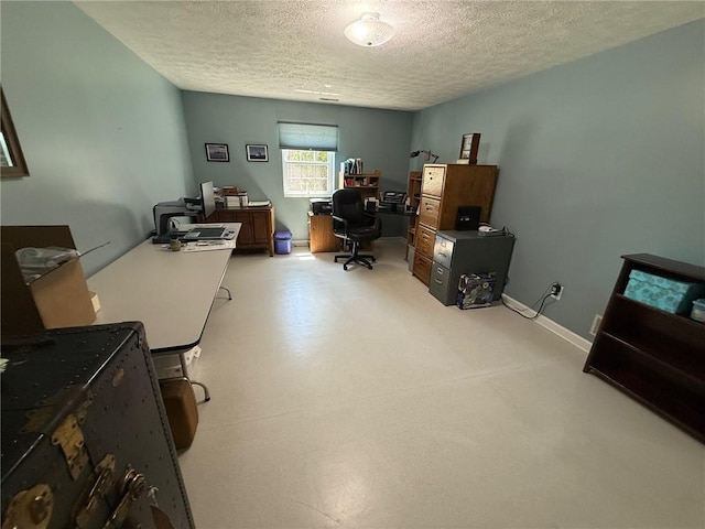 office area with baseboards and a textured ceiling