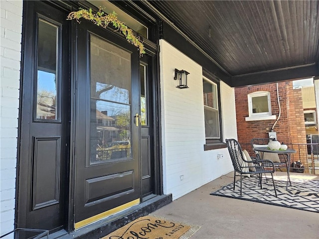 doorway to property featuring a porch