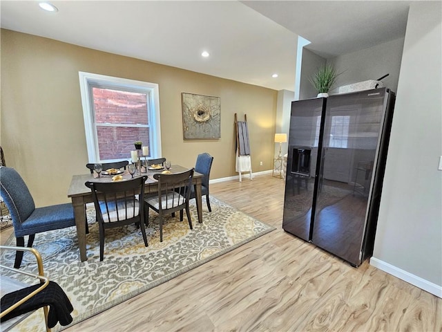 dining room featuring recessed lighting, baseboards, and light wood-type flooring