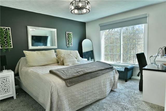 bedroom with carpet floors and baseboards