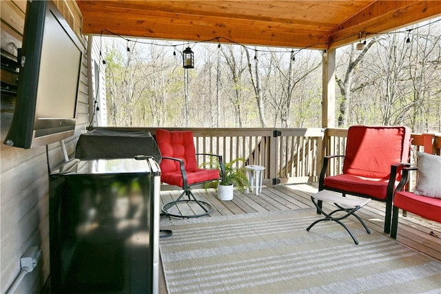 deck featuring a grill