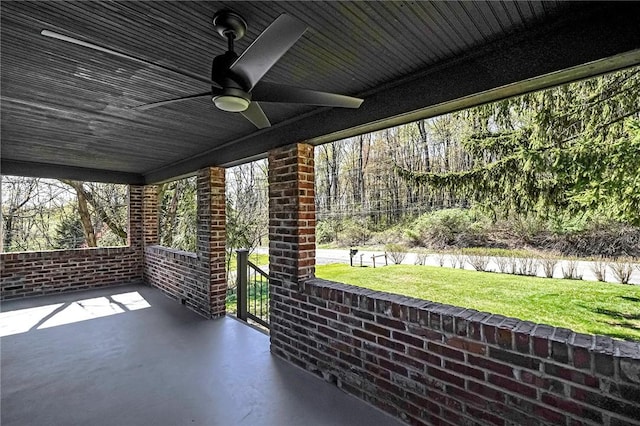 view of patio featuring ceiling fan