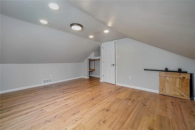 bonus room with recessed lighting, wood finished floors, visible vents, baseboards, and lofted ceiling
