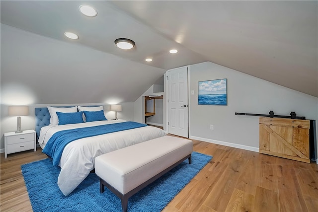 bedroom featuring recessed lighting, light wood-style floors, lofted ceiling, and baseboards