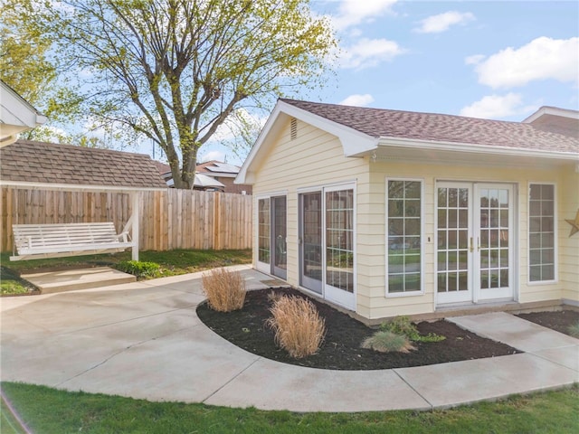 700 Mckinley Ave, City Of Washington, PA 15301 - view of side of property featuring fence, roof with shingles, and a patio