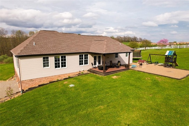 109 Brianna Ln, Oakland Twp, PA 16025 - rear view of property featuring a lawn, roof with shingles, a deck, french doors, and fence
