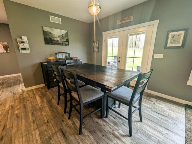 109 Brianna Ln, Oakland Twp, PA 16025 - dining area featuring visible vents, wood finished floors, french doors, and baseboards