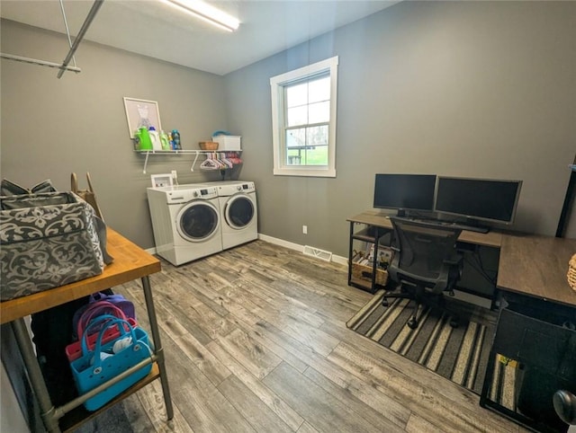109 Brianna Ln, Oakland Twp, PA 16025 - washroom featuring visible vents, baseboards, separate washer and dryer, wood finished floors, and laundry area