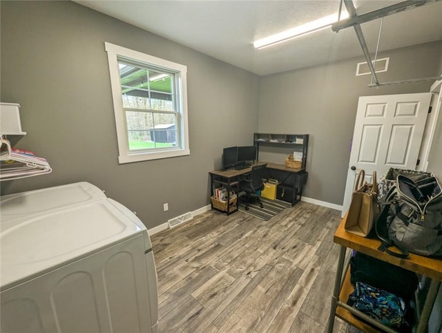 109 Brianna Ln, Oakland Twp, PA 16025 - washroom featuring visible vents, baseboards, separate washer and dryer, wood finished floors, and laundry area