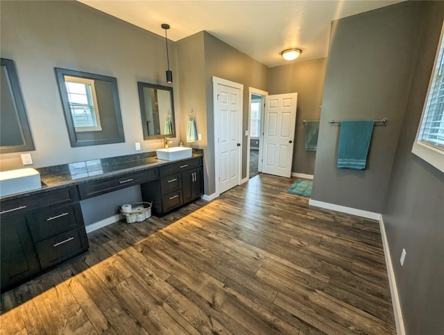 109 Brianna Ln, Oakland Twp, PA 16025 - full bathroom with baseboards, double vanity, wood-type flooring, and a sink